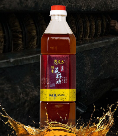A bottle of Shu Min Premium Roasted Rapeseed Oil on a dark background. 